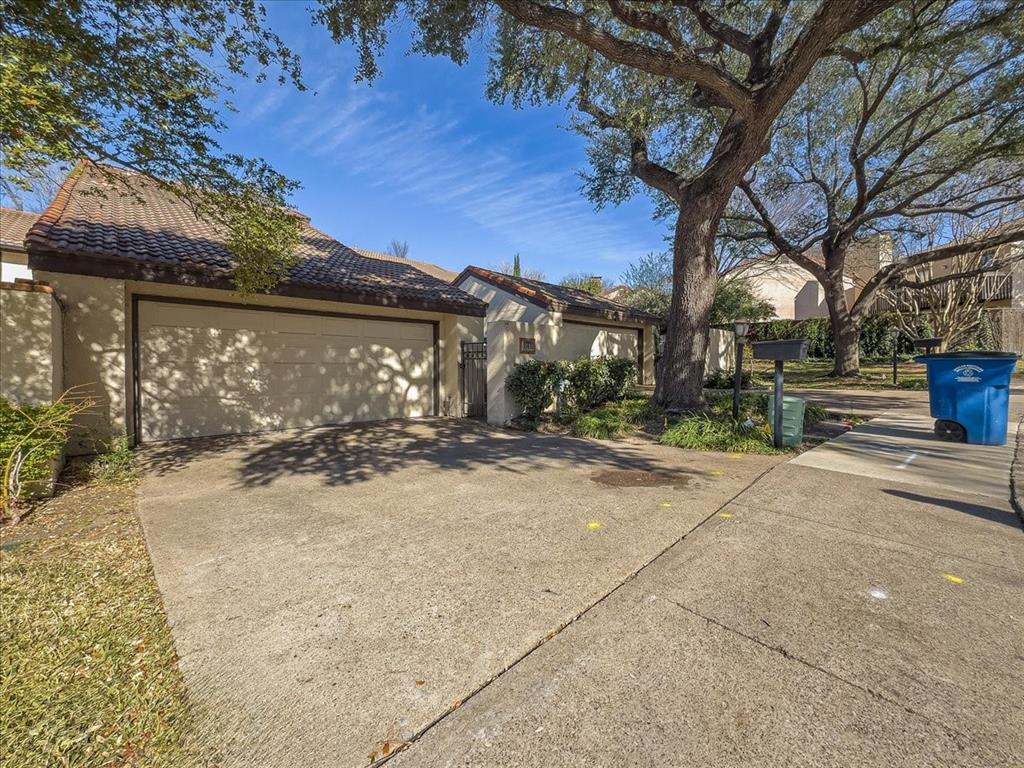 8411 Oak Streme Dallas, TX 75243 - Photo 2 of 28 a view of a house with a yard covered in snow