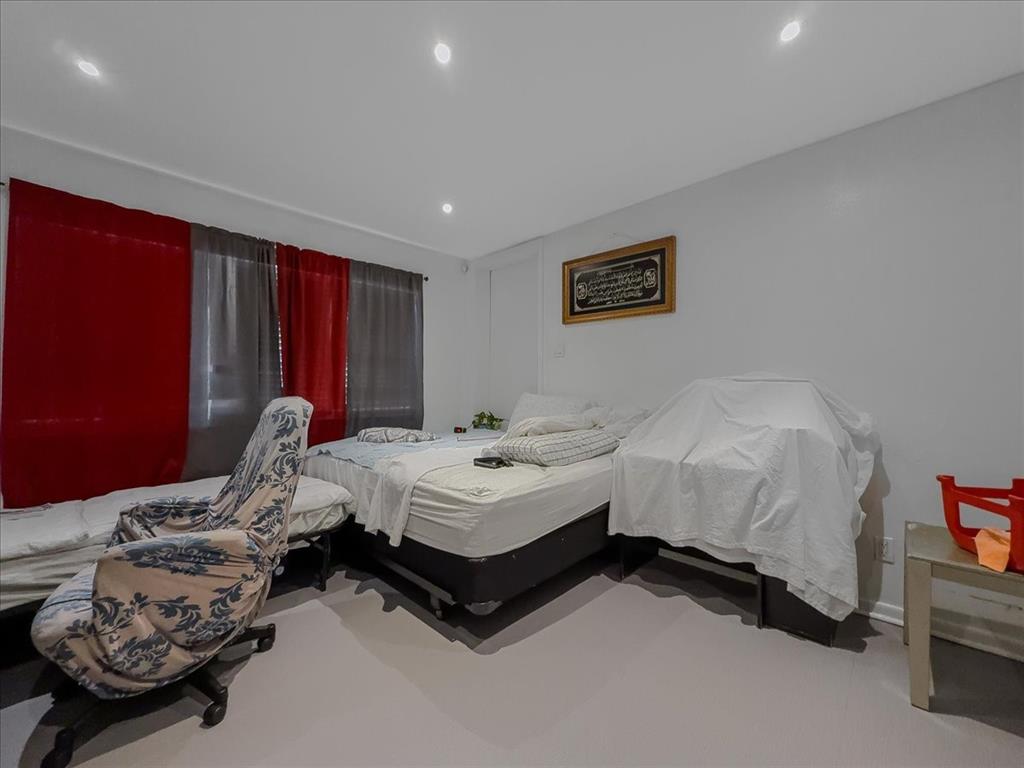 8411 Oak Streme Dallas, TX 75243 - Photo 21 of 28 a bedroom with bed and a window