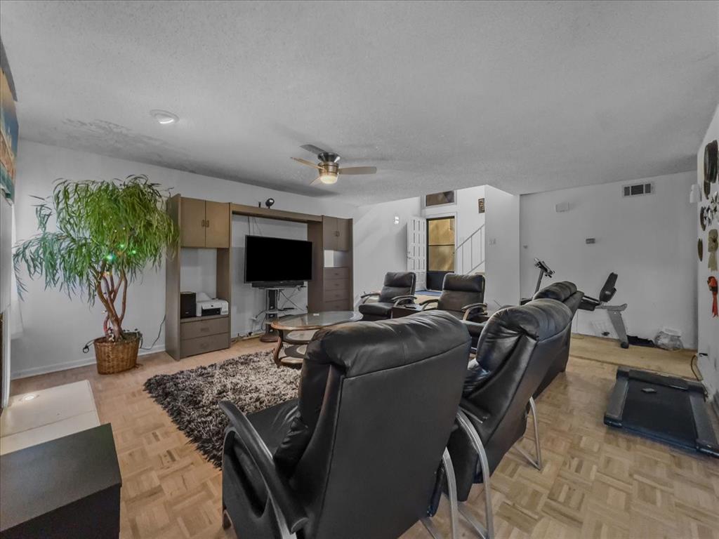 8411 Oak Streme Dallas, TX 75243 - Photo 4 of 28 a living room with furniture and a flat screen tv