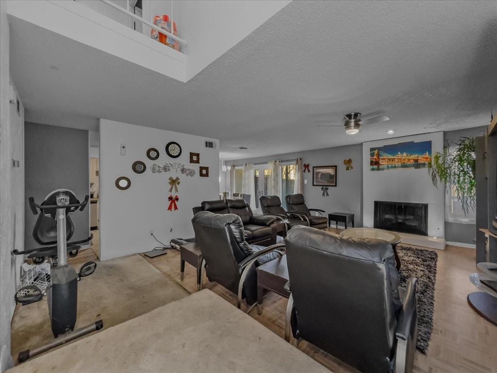 8411 Oak Streme Dallas, TX 75243 - Photo 5 of 28 a view of a livingroom with furniture and a fireplace