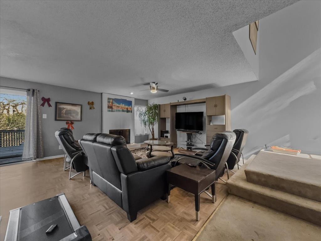 8411 Oak Streme Dallas, TX 75243 - Photo 6 of 28 a living room with furniture and a flat screen tv