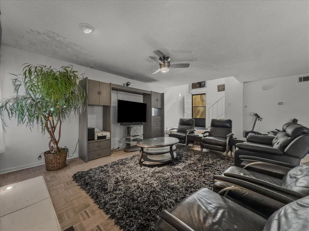 8411 Oak Streme Dallas, TX 75243 - Photo 8 of 28 a living room with furniture and a flat screen tv