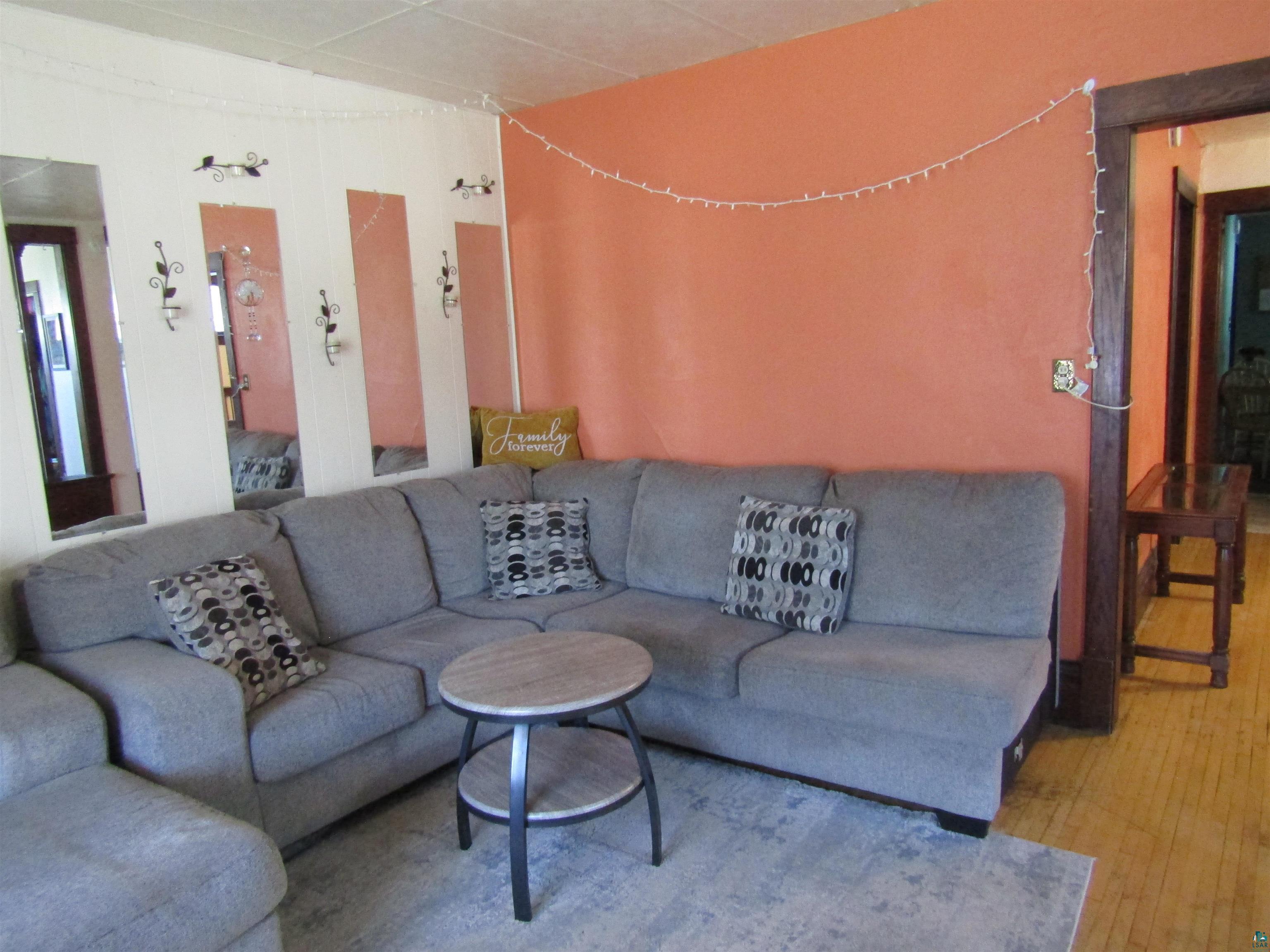 1115 Harrison Street Superior, WI 54880 - Photo 11 of 49 Interior space featuring an orange accent wall and light-toned flooring