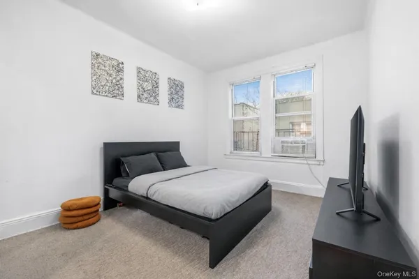 a bedroom with a bed and cabinets