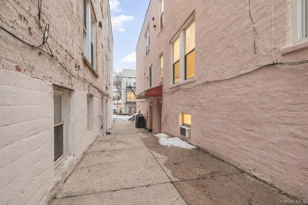 a picture of a bench in front of a wall