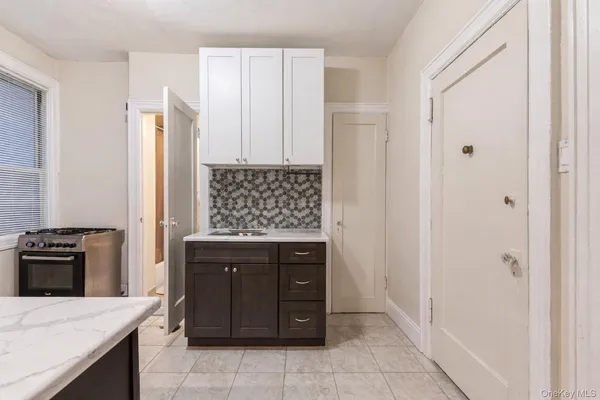 a kitchen with a refrigerator and stove