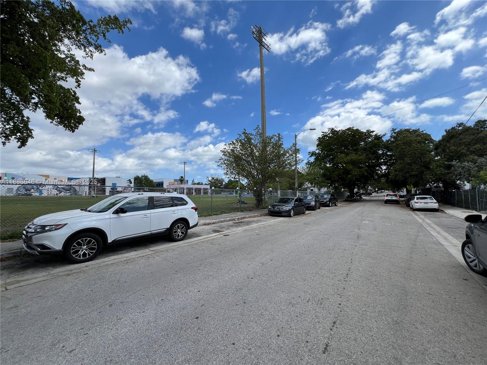 548 Northwest 30th Street, Unit 2 Miami, FL 33127 - Photo 12 of 12 a view of street with parked cars
