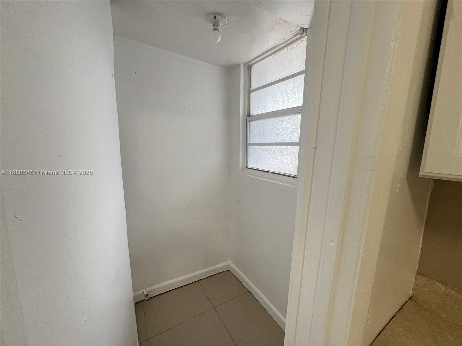 548 Northwest 30th Street, Unit 2 Miami, FL 33127 - Photo 10 of 12 a view of an empty room