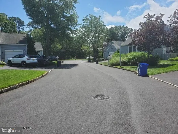a view of a street with a house