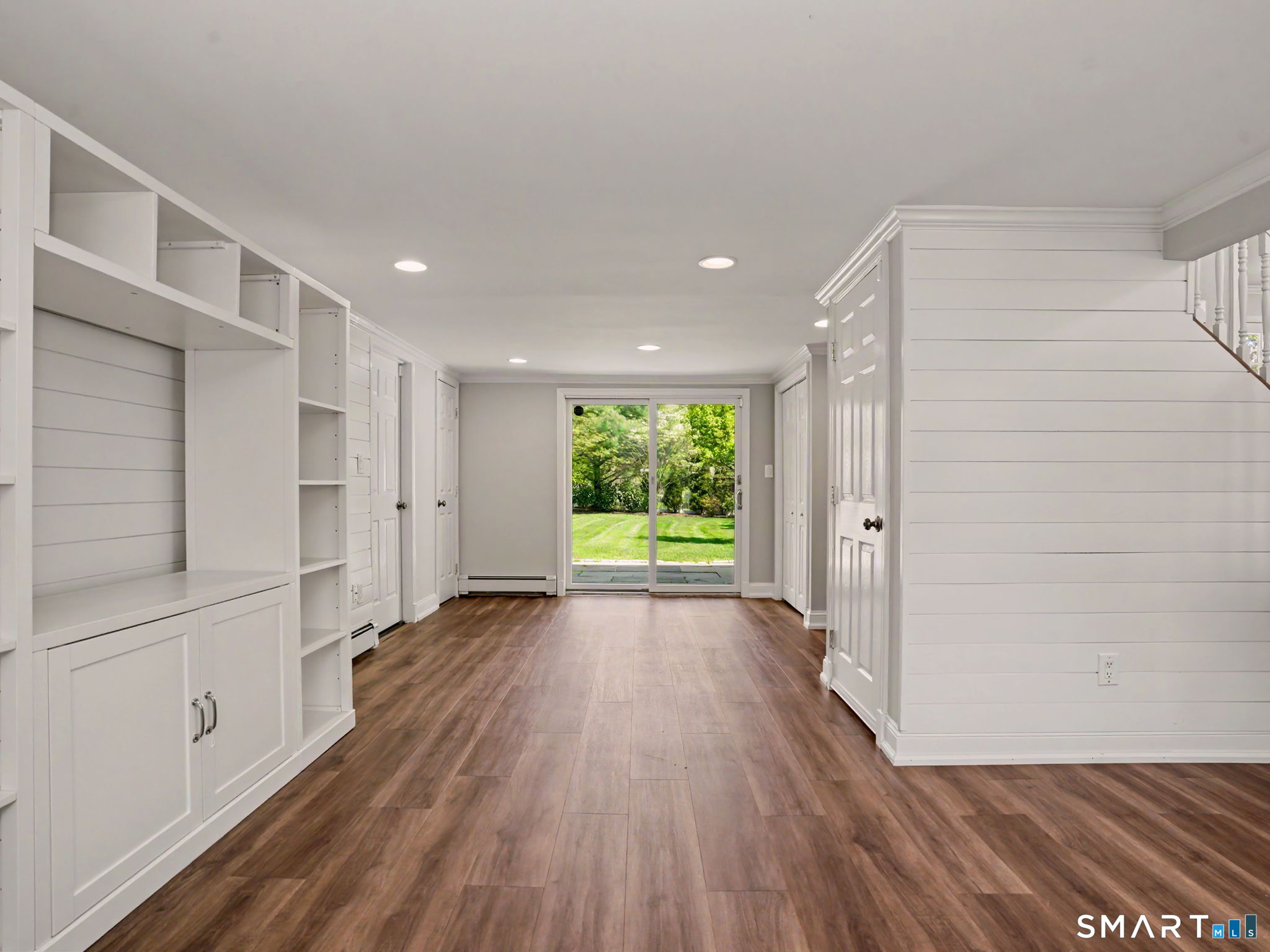 44 Sniffen Road Westport, CT 06880 - Photo 20 of 39 View of family room with access through sliding doors to rear patio