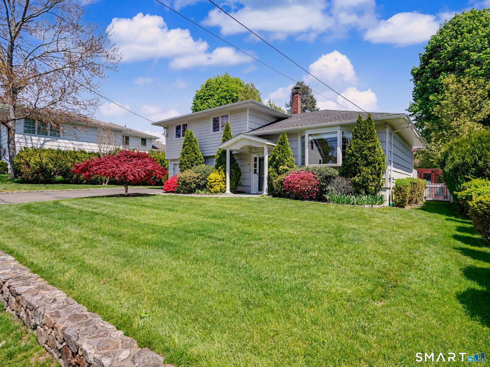 44 Sniffen Road Westport, CT 06880 - Photo 2 of 39 Stone wall across front of property