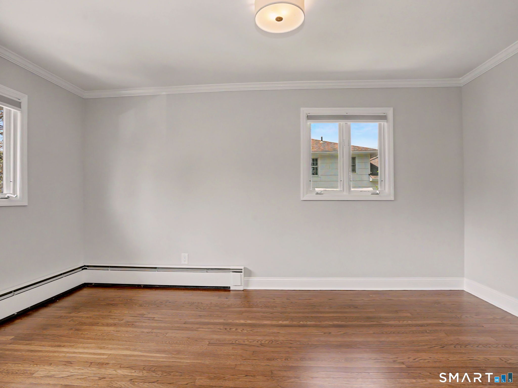 44 Sniffen Road Westport, CT 06880 - Photo 22 of 39 Guest bedroom with hardwood flooring