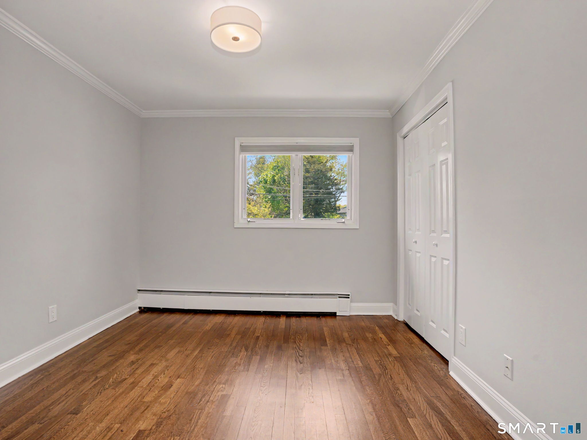 44 Sniffen Road Westport, CT 06880 - Photo 24 of 39 Bedroom with hardwood flooring