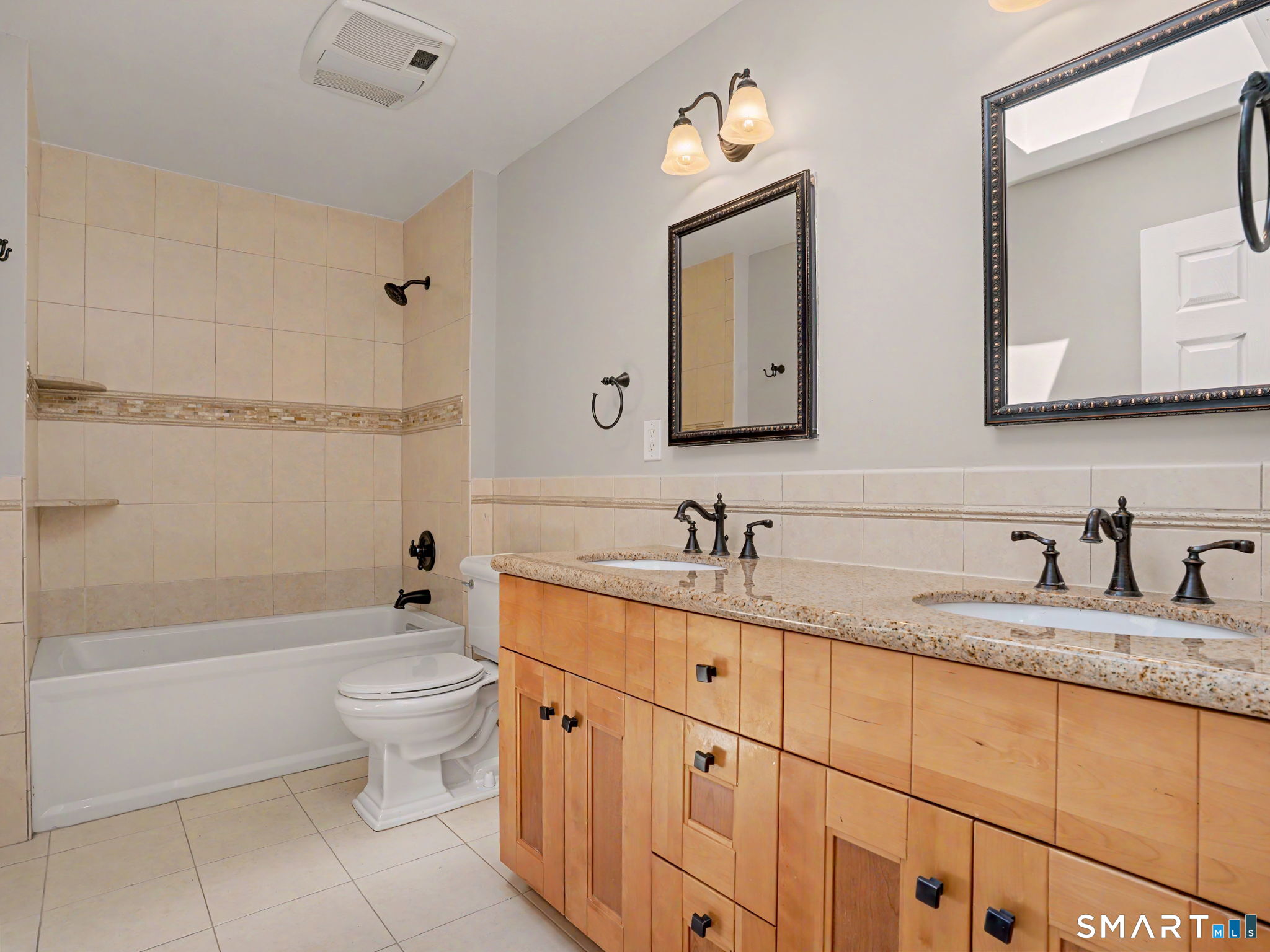 44 Sniffen Road Westport, CT 06880 - Photo 28 of 39 Full bath with double vanity and granite counter servicing the 3 bedrooms