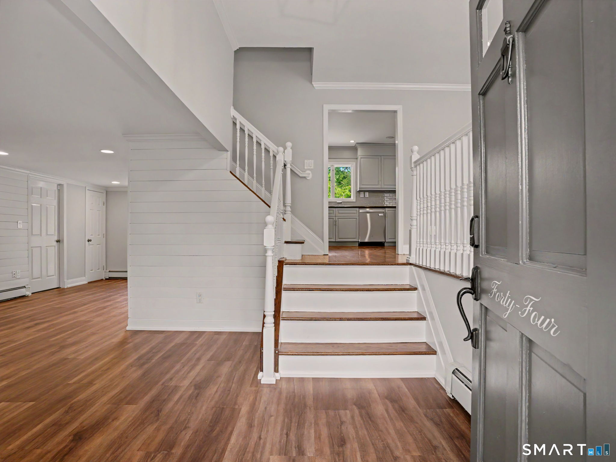 44 Sniffen Road Westport, CT 06880 - Photo 5 of 39 Front door leading into the family room with stairway to the open concept living and dining rooms plus kitchen