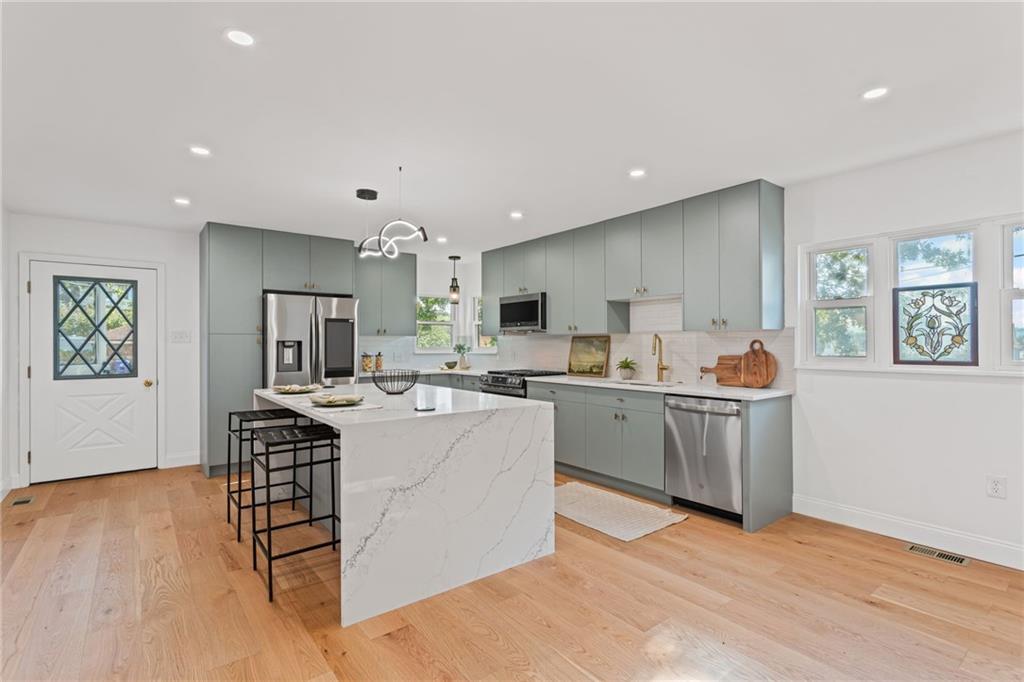 40 Walnut Street Crafton, PA 15205 - Photo 15 of 50 a living room with furniture a wooden floor and a sink