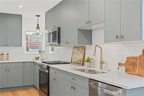 a kitchen with a sink and cabinets