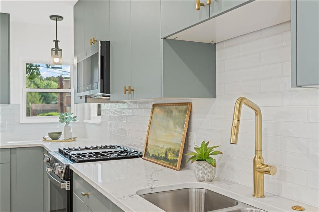 40 Walnut Street Crafton, PA 15205 - Photo 21 of 50 a kitchen with a sink stove and microwave