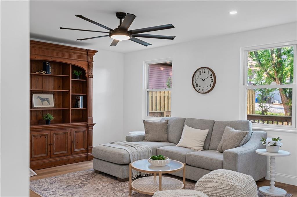 40 Walnut Street Crafton, PA 15205 - Photo 26 of 50 a living room with furniture a window and a clock