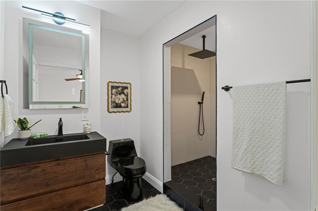 40 Walnut Street Crafton, PA 15205 - Photo 29 of 50 a bathroom with a sink and a mirror