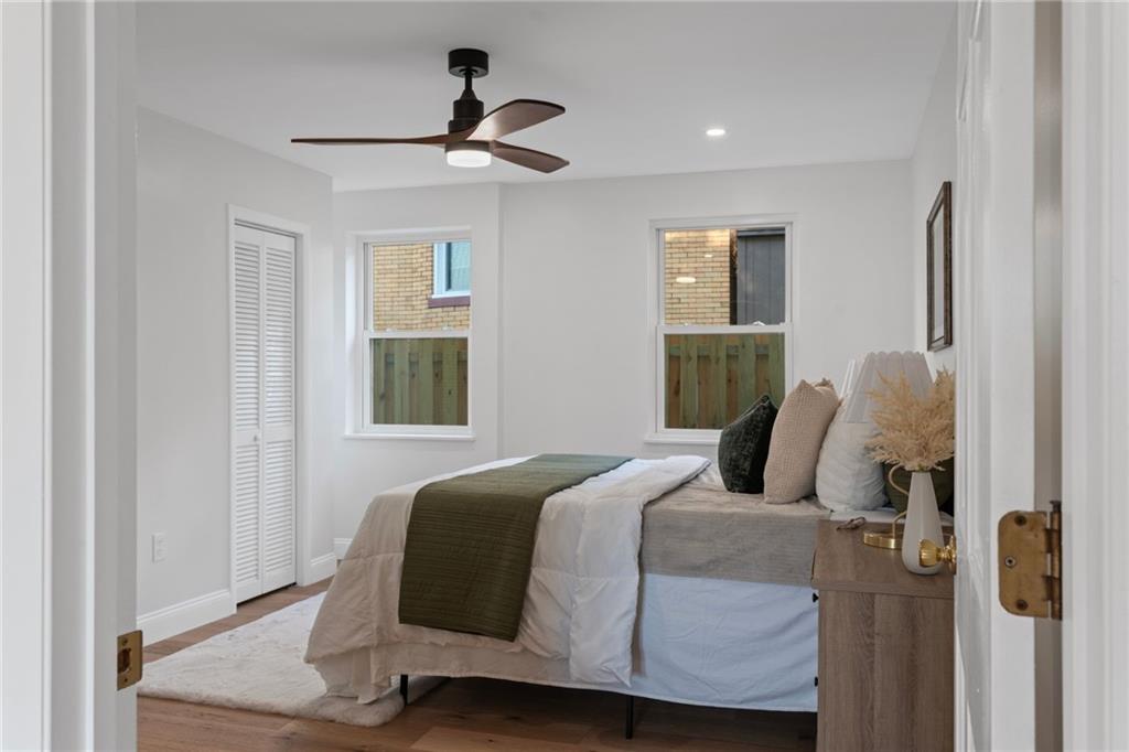 40 Walnut Street Crafton, PA 15205 - Photo 30 of 50 a bedroom with a bed and wooden floor