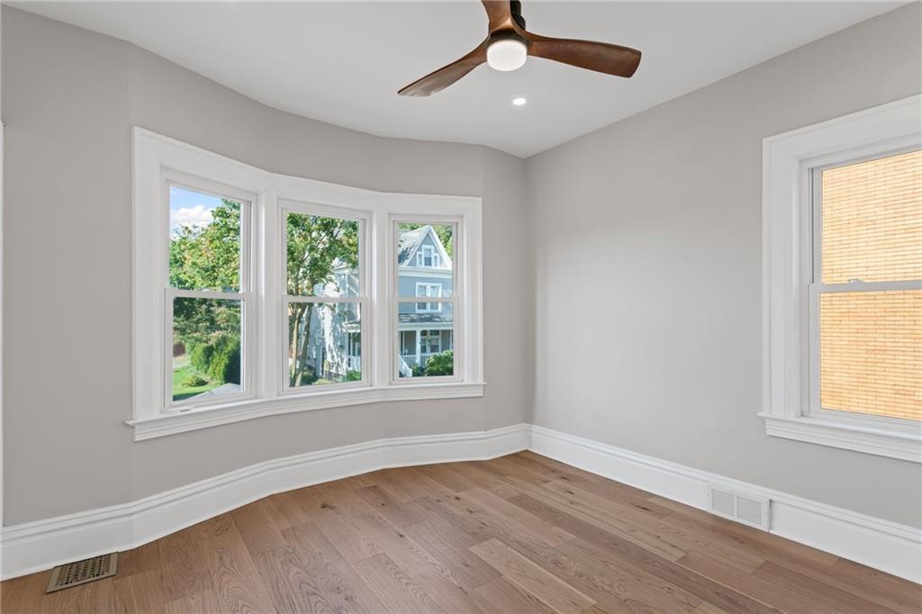 40 Walnut Street Crafton, PA 15205 - Photo 36 of 50 a view of an empty room with wooden floor and a window