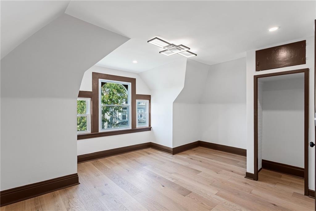 40 Walnut Street Crafton, PA 15205 - Photo 40 of 50 a view of an empty room with wooden floor and a window