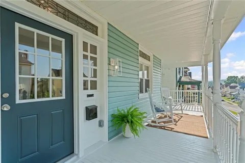a potted plant sitting in front of a house