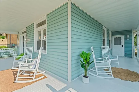 a view of a chair and table in the balcony