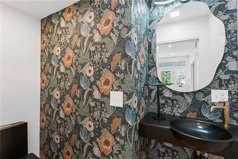 a bathroom with a sink and mirror