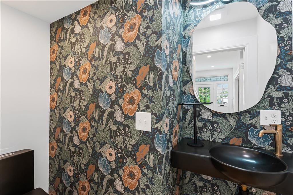 40 Walnut Street Crafton, PA 15205 - Photo 7 of 50 a bathroom with a sink and mirror