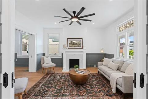 a living room with furniture and a fireplace