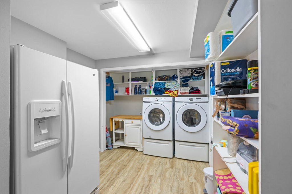 711 Cardinal Drive Kerrville, TX 78028 - Photo 22 of 30 a utility room with fridge dryer and washer