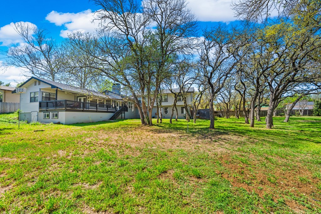711 Cardinal Drive Kerrville, TX 78028 - Photo 24 of 30 a view of a house with a yard