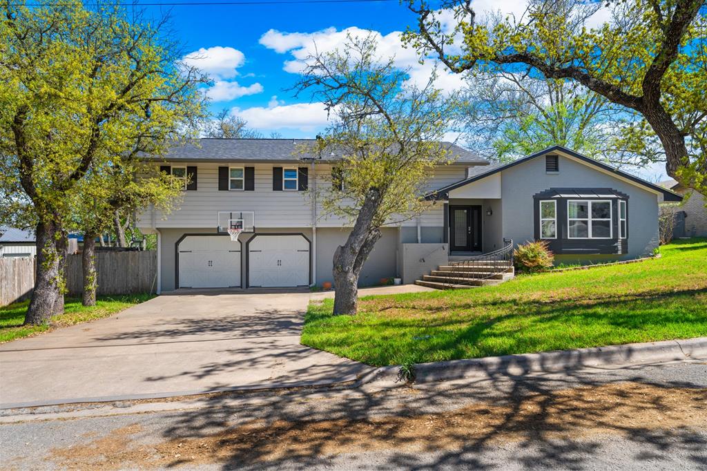711 Cardinal Drive Kerrville, TX 78028 - Photo 30 of 30 a front view of a house with a yard and garage