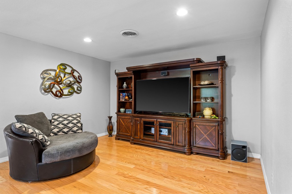 711 Cardinal Drive Kerrville, TX 78028 - Photo 7 of 30 a living room with furniture and a flat screen tv