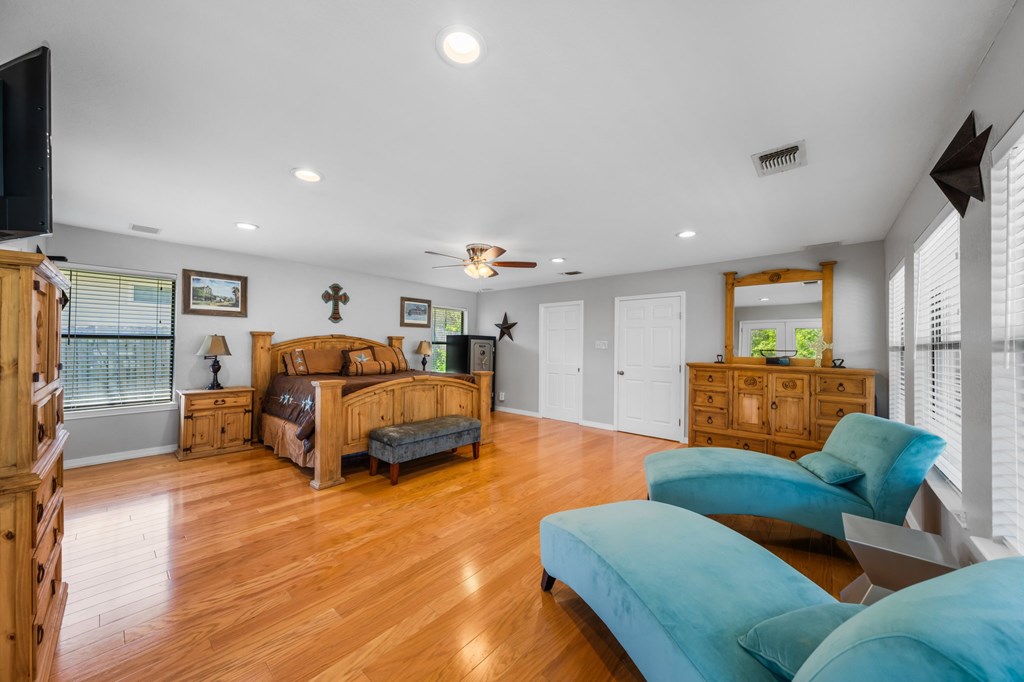 711 Cardinal Drive Kerrville, TX 78028 - Photo 8 of 30 a bedroom with furniture and a flat screen tv