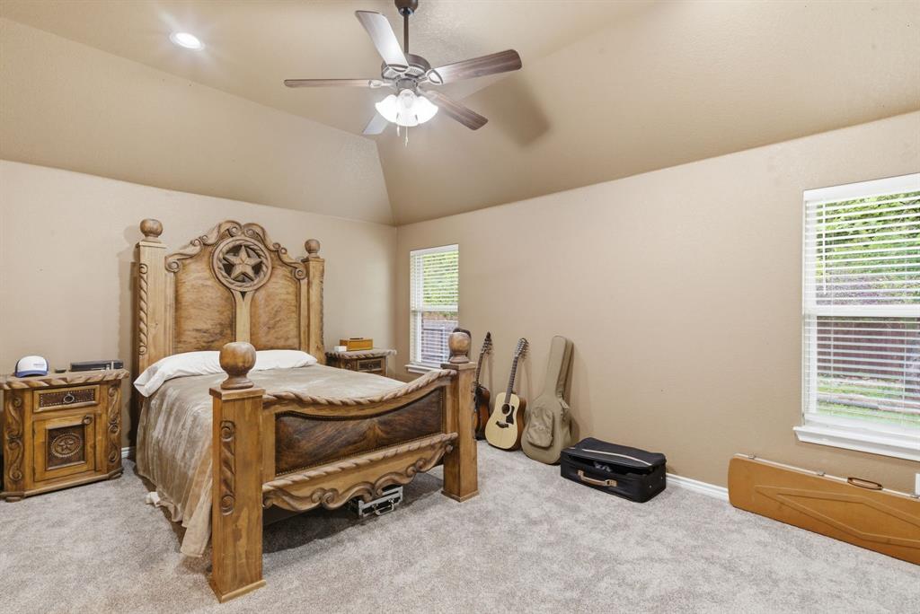 940 Elk Ridge Drive Stephenville, TX 76401 - Photo 11 of 23 a bed room with furniture and a window