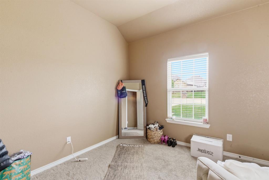 940 Elk Ridge Drive Stephenville, TX 76401 - Photo 16 of 23 a living room with furniture and a window