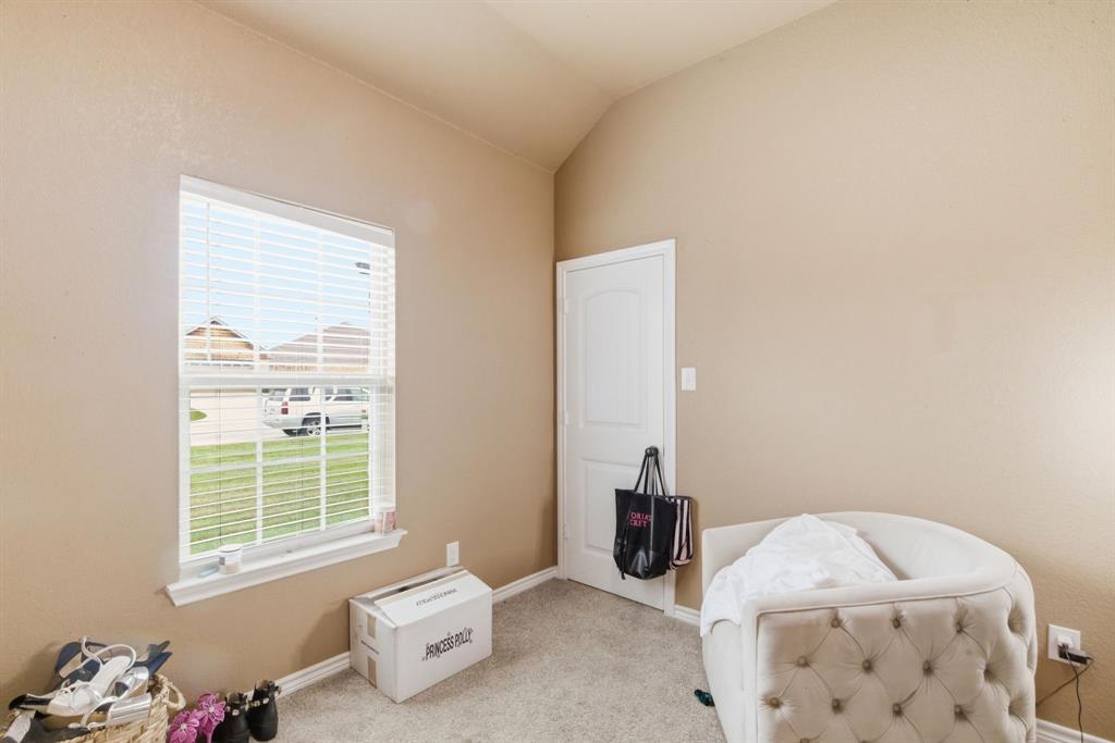 940 Elk Ridge Drive Stephenville, TX 76401 - Photo 17 of 23 a bedroom with furniture and a window