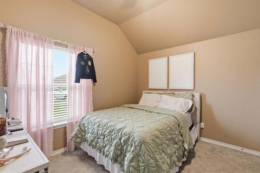 940 Elk Ridge Drive Stephenville, TX 76401 - Photo 20 of 23 a bedroom with a bed and a window