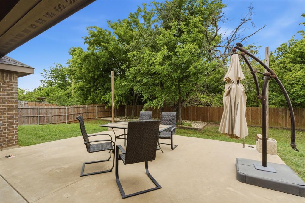 940 Elk Ridge Drive Stephenville, TX 76401 - Photo 21 of 23 a view of backyard with seating area and green space