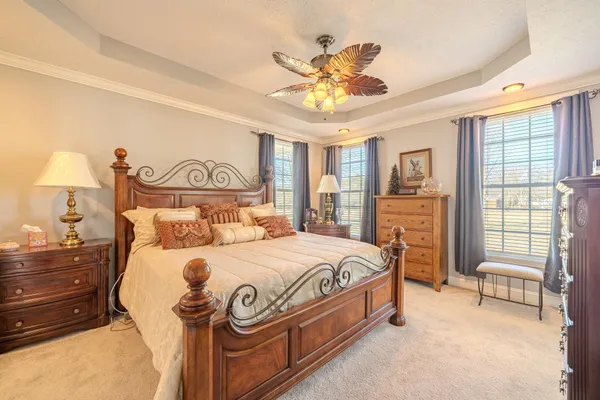 a bathroom with a sink double vanity mirror and a bathtub