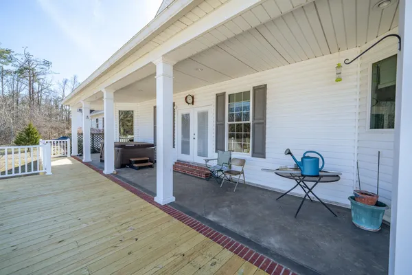 a bathroom with a granite countertop toilet sink and mirror or bathtub