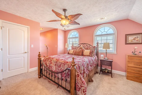 a view of an entryway with wooden floor and door