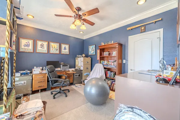 a view of a house with a big yard and large trees