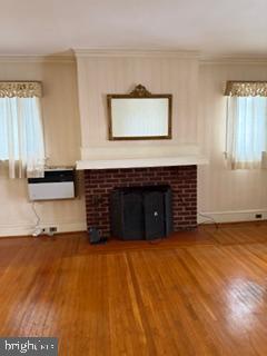 4640 Adams Avenue Philadelphia, PA 19124 - Photo 11 of 34 a view of an empty room with a fireplace and a window