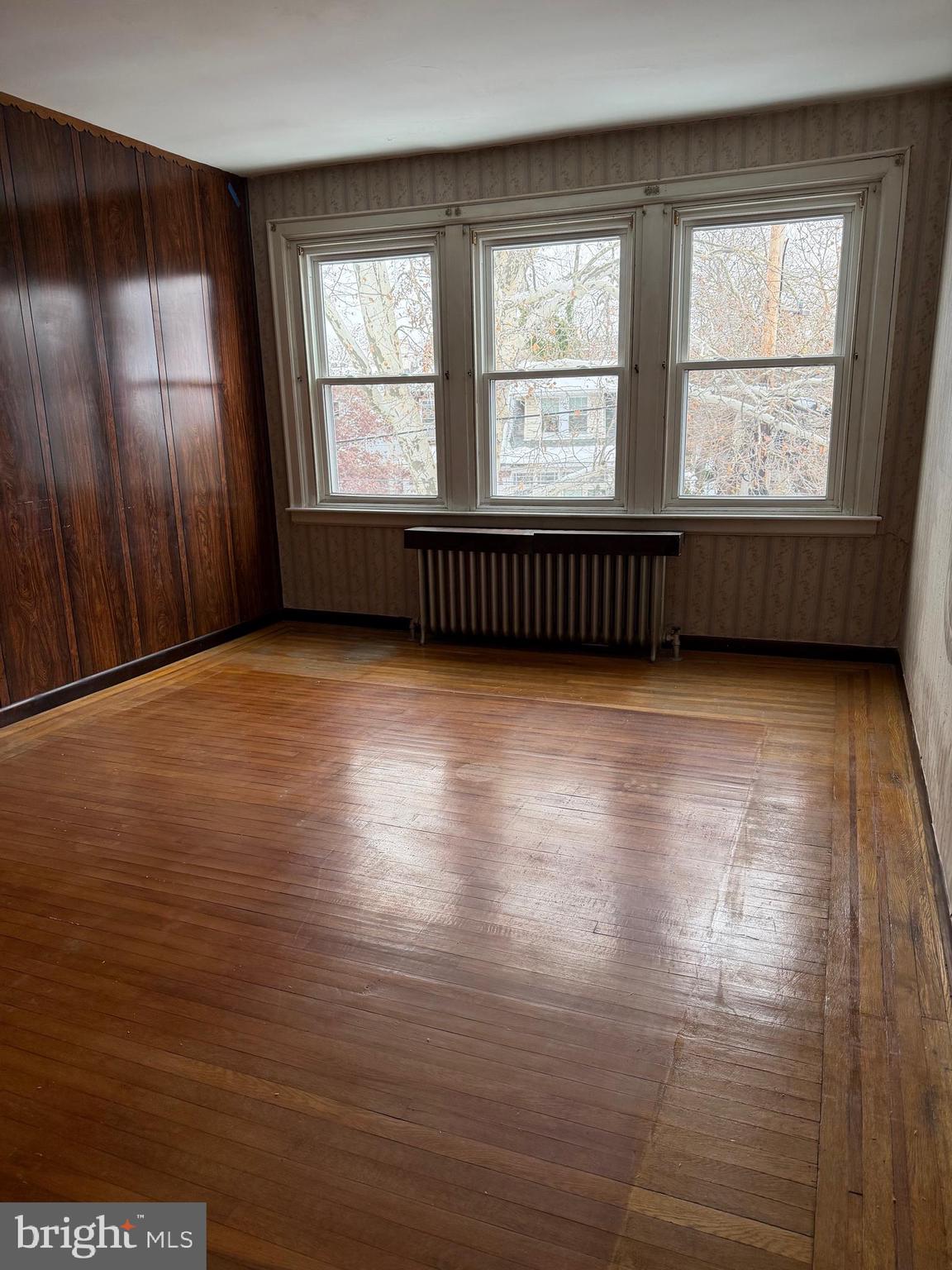 4640 Adams Avenue Philadelphia, PA 19124 - Photo 19 of 34 wooden floor in an empty room with a window