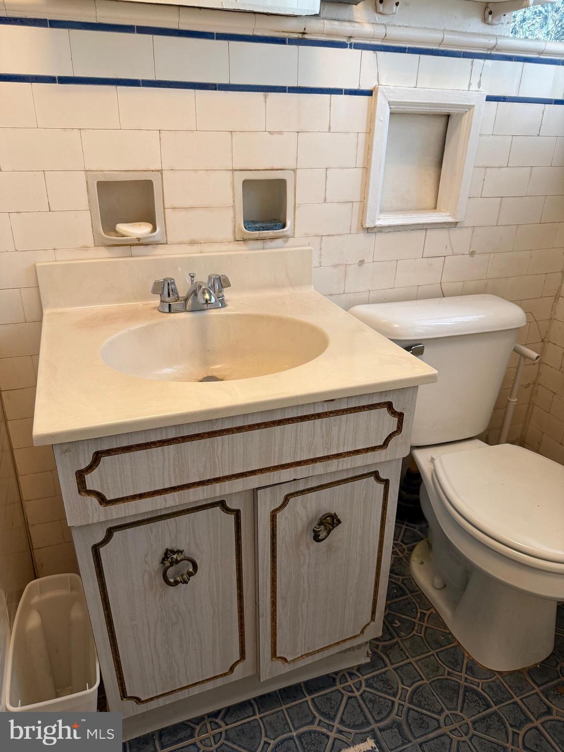 4640 Adams Avenue Philadelphia, PA 19124 - Photo 23 of 34 a close view of a sink a toilet and a rug