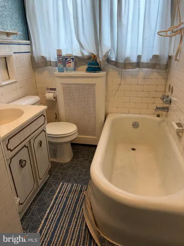 a bathroom with a sink and toilet